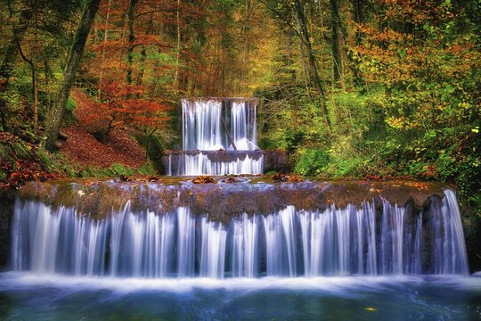 Village stream with waterfalls, cascades in autumn forest, K&uuml;snacht, Canton Zurich, Switzerland