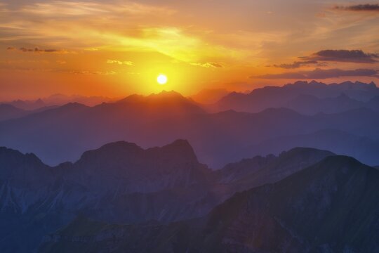 View from Brienzer Rothorn to Central Swiss Alps, cloudy atmosphere at sunrise, Canton Bern, Canton Obwaden, Switzerland
