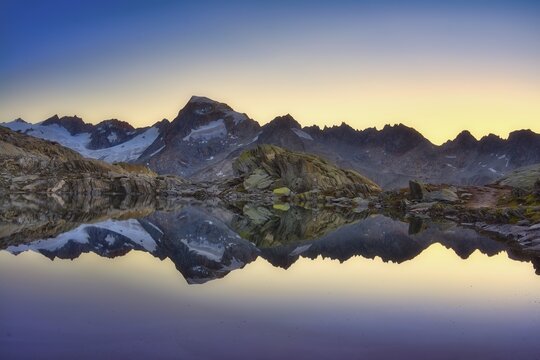 Gr&auml;tlisee with reflection of the mountains in the morning light, Canton Valais, Switzerland
