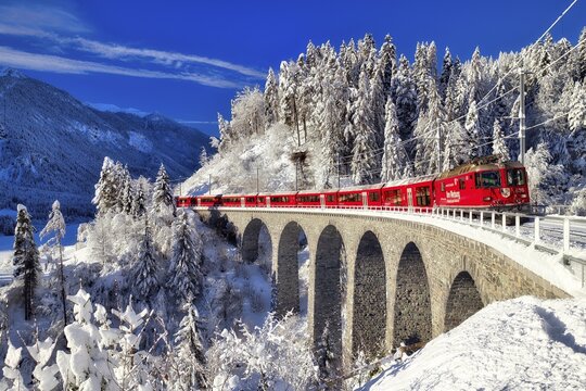 Rhaetian railway on viaduct in winter landscape, near Filisur, Canton Graub&uuml;nden, Switzerland