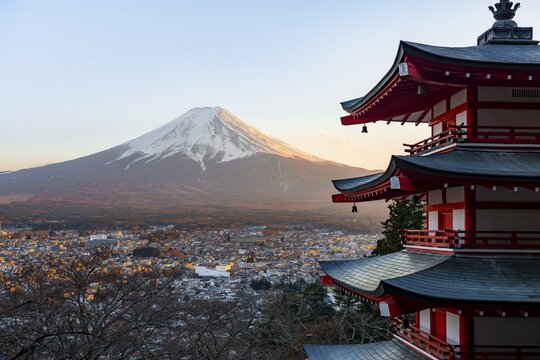 Five-story pagoda of a Shinto Shrine, Chureito Pagoda, with views of Fujiyoshida City and Mount Fuji volcano at sunset, Arakura Fuji Sengen Shrine, Arakurayama Sengen Park, Yamanashi Prefecture, Japan