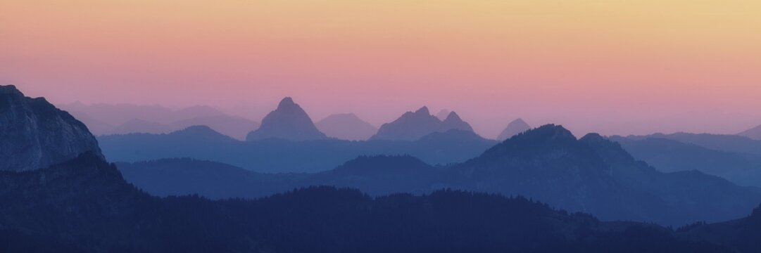 Panorama hilly landscape with mountains Kleiner and Gro&szlig;er Mythen after sunset, cloudless, atmospheric evening sky, Canton Schwyz, Switzerland