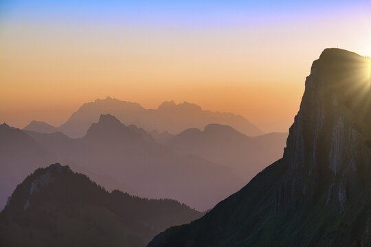 Appenzell Alps with Alpstein and S&auml;ntis at sunrise, in the foreground rock face of the Tierberg, cantons of Glarus and St. Gallen, Switzerland