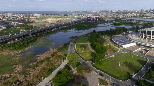 Aerial view of the Wole Soyinka Centre for Culture and Creative Arts and National Theatre Nigeria with the Eko Bridge and surrounding urban landscape in Lagos, Lagos, Nigeria.