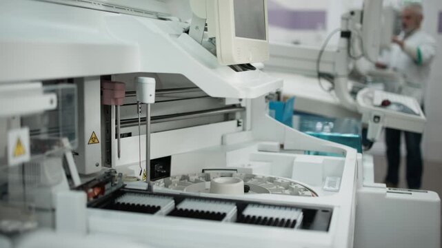 Close-up of modern laboratory diagnostic equipment in sterile clinical environment. Concept medical technology, automated diagnostics and virology research including coronavirus (COVID-19) and hantavi
