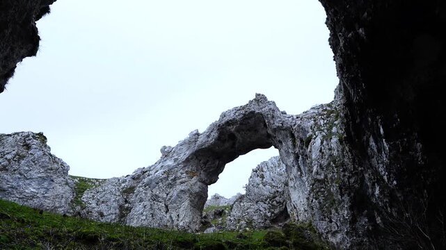 Stone Arch of Urbasa near the Lizarraga Pass in the Andia Mountains. Urbasa and Andia Natural Park. Navarre. Spain. Europe