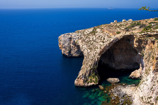 Blue Grotto Natural Stone Arch and Sea Cave with Filfla Island on Horizon, Malta