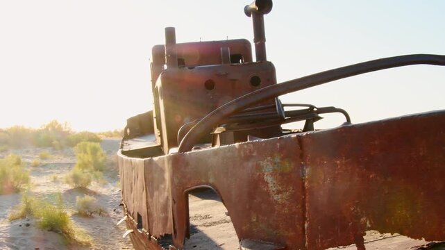 Moynaq Ship Graveyard Uzbekistan sunrise. Rusted fishing vessels stranded in the Aralkum Desert. Environmental disaster memorial showing the dried Aral Sea and lost maritime heritage in Muynak.