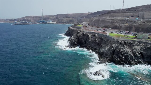 Beautiful aerial view showing the Atlantic Ocean waves crashing on the rocky coast of La Laja beach in Las Palmas, Gran Canaria, Spain