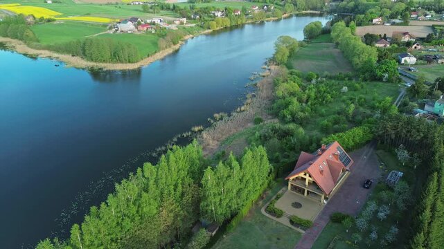 Drone Shot of Lake Shore with Trees and Farmland &ndash; 4K ProRes