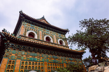 Obraz premium Summer Palace imperial Chinese with wall ornamentation, vivid color palette, traditional rooflines and historic garden setting, Beijing, China