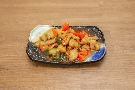 A Chinese recipe for sweet and sour stewed chicken with vegetables and sauce