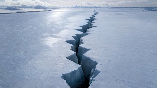 uriel. Aerial view of a deep lightning-shaped crack splitting a smooth glacier surface. travel magazines, destination branding, designed for travel destination branding, used by lab technicians.
