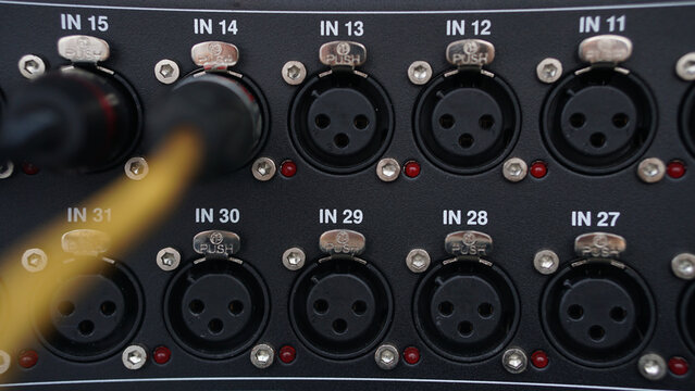 Close-Up of Audio Mixer Rear Panel with XLR Cable Connections