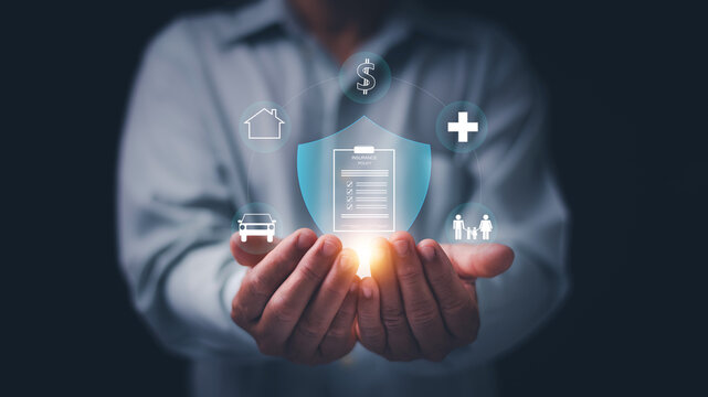 Man holding virtual insurance protection shield with policy document and icons health, family, home, vehicle. Insurance protection concept. Risk management, financial security and asset protection.