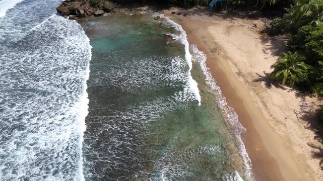 Top Down Drone View of Waves Rolling Into Pools Beach Rincon Puerto Rico
