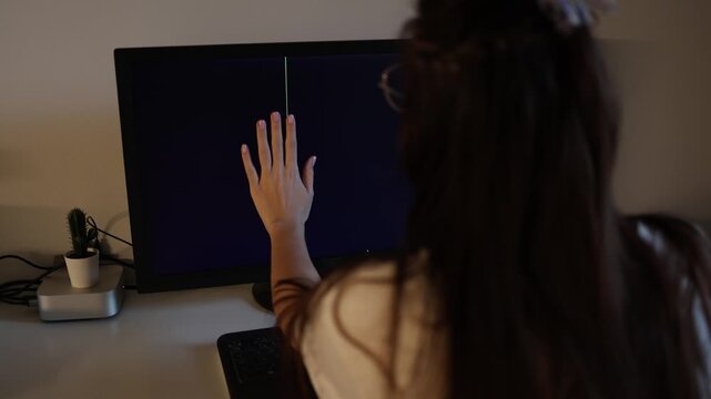 Young woman working at computer with damaged black screen and horizontal glitch lines stressful technology issue modern workspace cinematic office scene