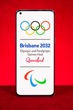 ZHONGSHAN China-May 12,2026: mobile of Brisbane 2032 Olympic and Paralympic Games logo on red at vertical composition.