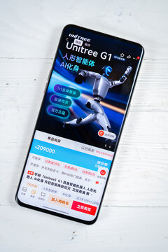 ZHONGSHAN China-May 4 2026: hand holding a smartphone displaying the Unitree G1 humanoid robot product page on JD.com at vertical composition.