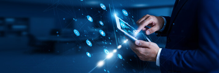 IoT Engineer touching IoT using tablet smart network, connected devices, sensors, data exchange, automation, real-time monitoring. © FutureLogic Studio