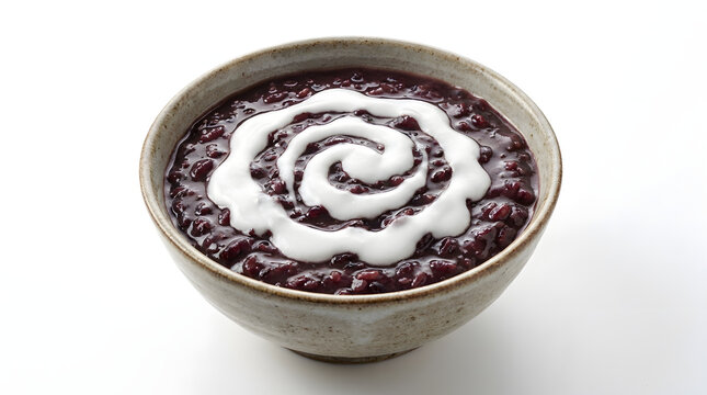 Malaysian Bubur Pulut Hitam black glutinous rice porridge with a swirl of coconut cream, isolated on white