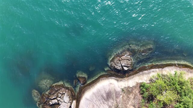Top Down Aerial of Large Rocks on a Tropical Beach