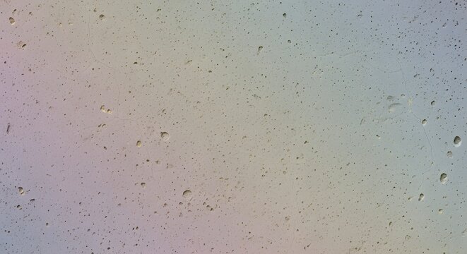 Soft pastel concrete texture background showing fine porous details micro cracks and a subtle multicolored rainbow gradient wash across the surface