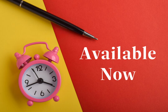 Available now concept with pink alarm clock and pen on colorful background representing instant service, availability, business support, and quick response.