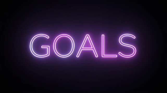 Neon sign displaying the word 'GOALS' in glowing purple and pink letters against a dark background, representing aspirations and objectives in a vibrant, modern style