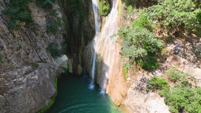 Aerial Drone View of Polylimnio Waterfalls with Turquoise Pool and Rocky Canyon in Messinia, Greece