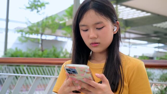 vibrant lifestyle photo of a modern young woman interacting with an artificial intelligence assistant on her smartphone.
