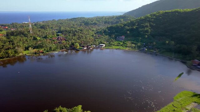 Aerial View of Danau Yeh Malet Lake and Lush Tropical Hillside in Bali, Indonesia