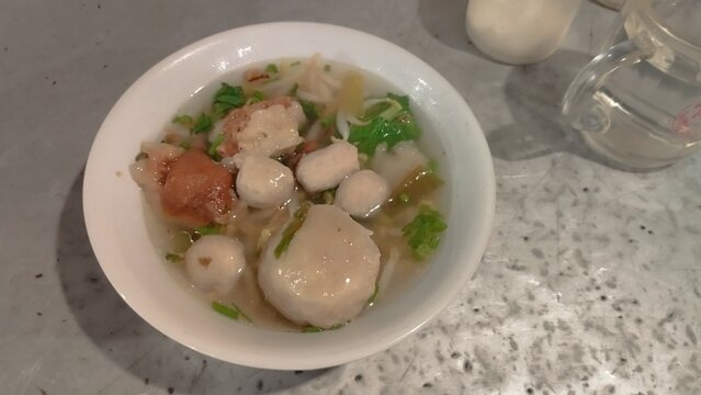 baso soup inside white bowl