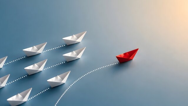 Red paper boat breaking away from the formation representing disruptive business innovation unique strategy and forging a new creative path