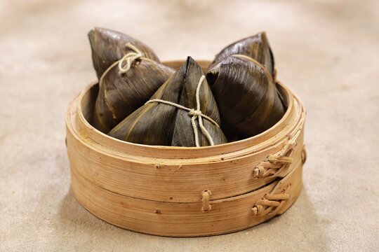 Bakcang, zongzi, bakchang. Chinese savoury sticky rice dumplings in bamboo leaves wrapping