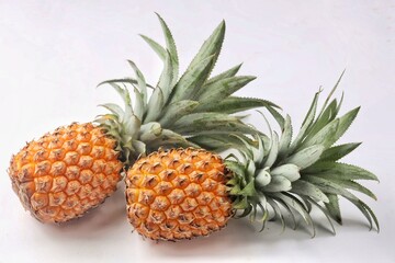 Obraz premium pineapple featuring vibrant yellow color, spiky green crown, and fresh juicy texture