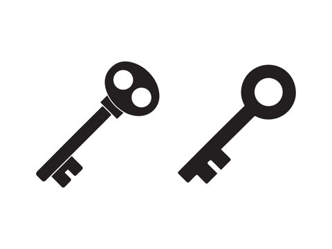 Two black skeleton keys with different shapes and sizes on white background  old fashioned keys