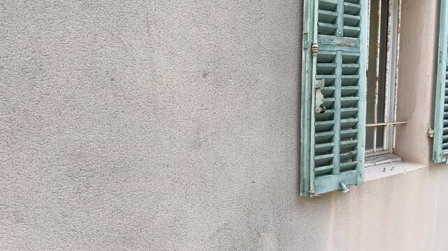 Weathered Green Window Shutters on Rustic French Architecture in Cassis