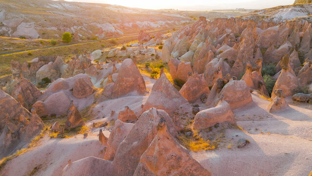 Goreme, Nevsehir, Turkey. Serene evening view of Devrent Valley with mystical rock formations and peaceful atmosphere during sunset meditation hours.. Aerial View