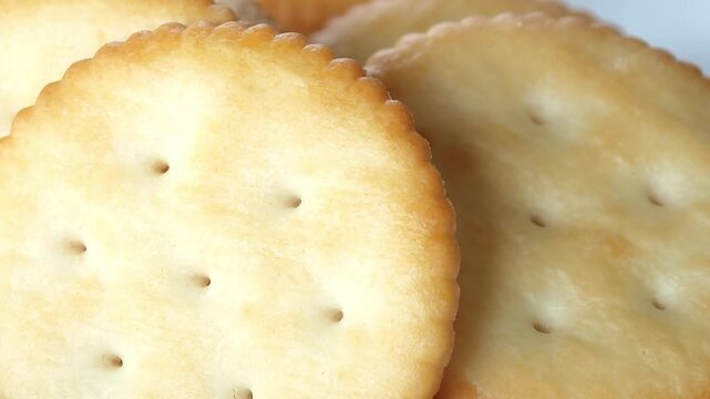 Freshly baked crackers served on a plate.