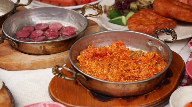 Enjoying Turkish breakfast with local dishes in a cafe