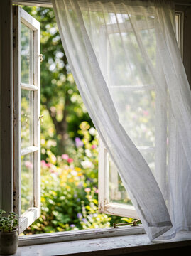 White Curtains Blowing in the Wind by an Open Window