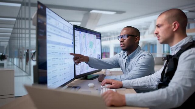 Private Investigator Carefully Reviews Case Files On Computer