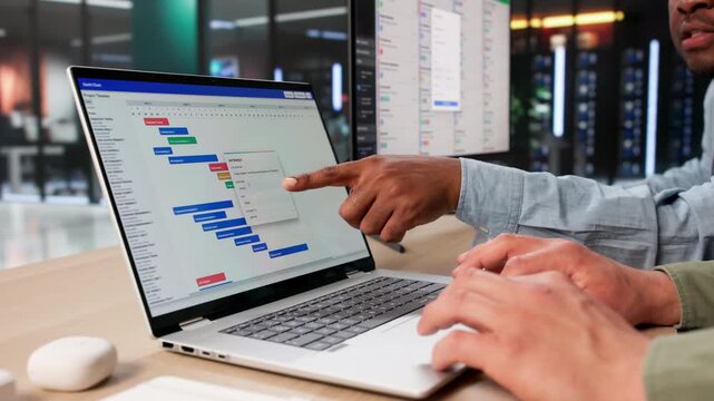 Project Managers Review Gantt Chart Schedules Together
