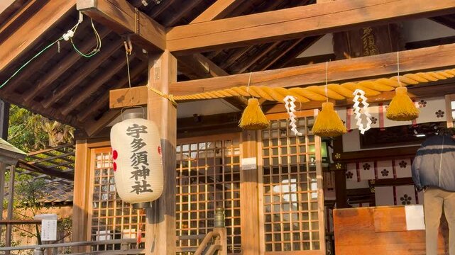 Traditional Shinto Shrine Entrance with Shimenawa Rope and Paper Shide