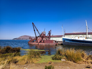 Fototapeta premium Lake port with seabed dredging barge