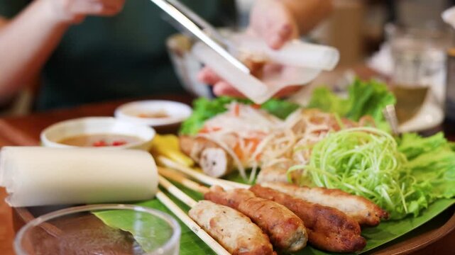 Vietnamese Nem Nuong Grilled Pork Skewers with Rice Paper and Fresh Herbs