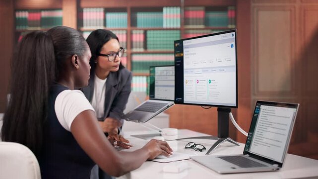 Lawyers Reviewing Documents On Computer