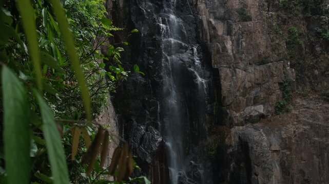 Low flow volume from the Haew Narok waterfall in the dry season. Rain forest at Khao Yai National Park in Thailand.
