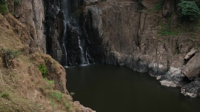Low flow volume from the Haew Narok waterfall in the dry season. Rain forest at Khao Yai National Park in Thailand.